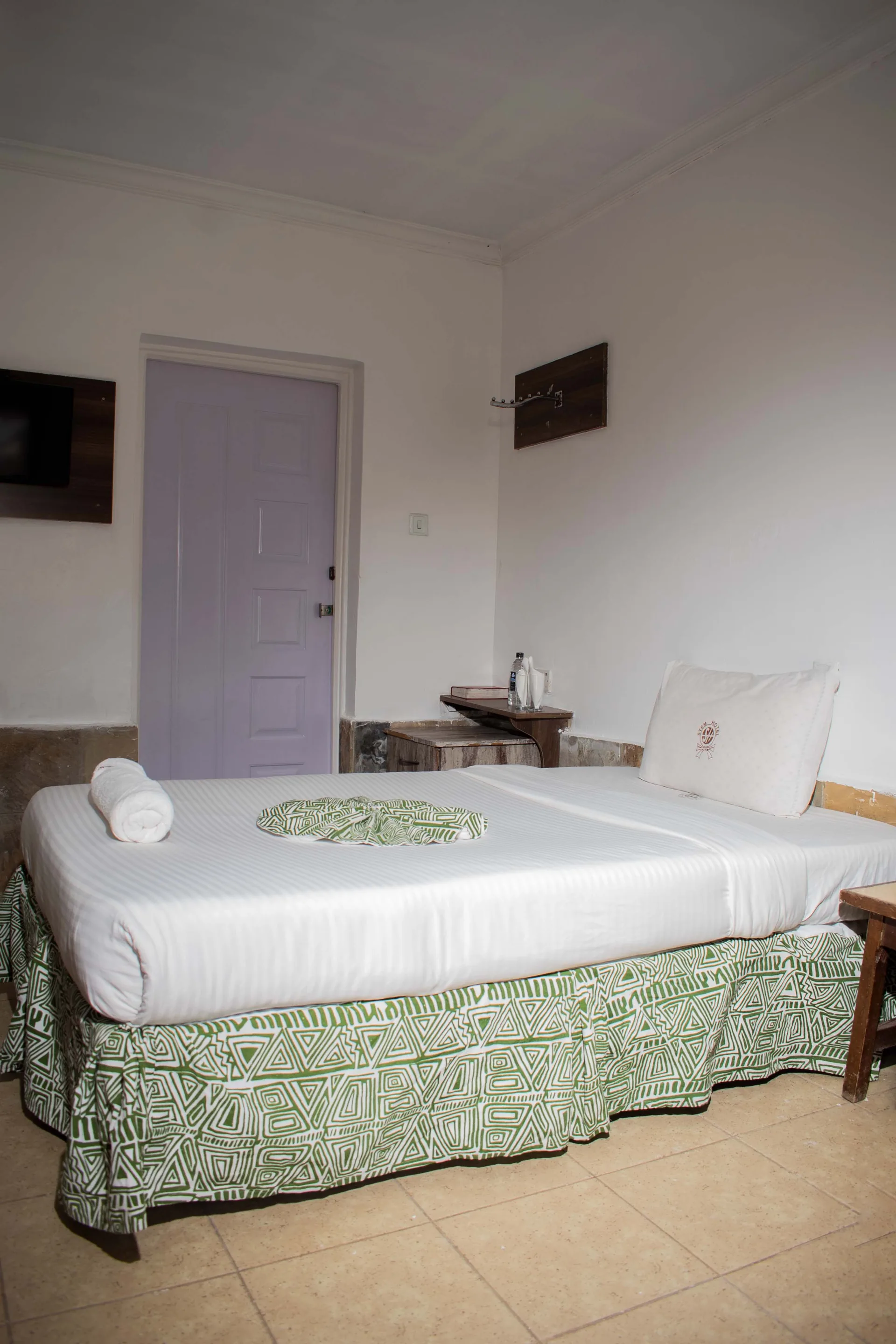 Elegant guest room at The Stem Hotel